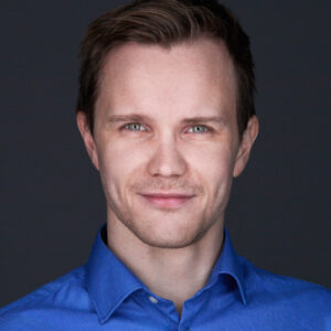 Portraint of Mikael Zeiner in a blue shirt