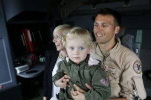 A small girl on her fathers lap